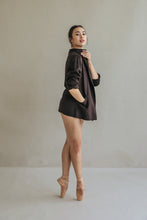 Load image into Gallery viewer, Draped in an oversized Mornington woven cashmere blazer with raw-edge stitches, a woman poses gracefully on pointe in ballet shoes, standing against a neutral background and exuding elegance and balance.