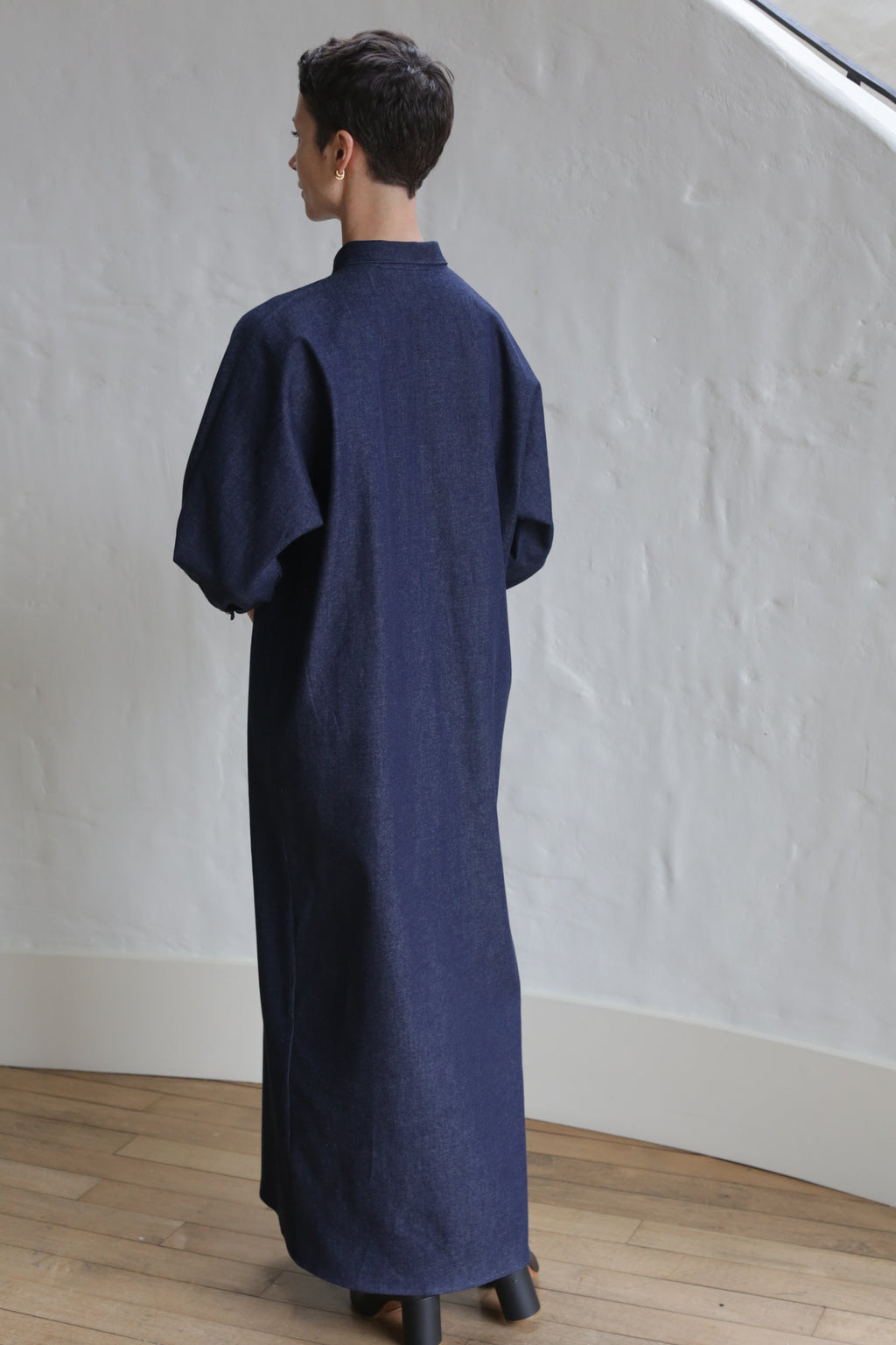 A person wearing the Atelier Coat | Denim Stretch.