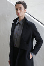 Load image into Gallery viewer, A woman wearing the X-Scarf Coat in Watermark Black.