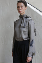 Load image into Gallery viewer, A woman in a Sash Blouse with a small butterflies print.