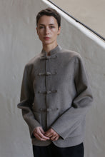 Load image into Gallery viewer, A woman wearing the Mandarin Jacket in undyed natural.