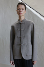 Load image into Gallery viewer, A woman in a Mandarin Jacket in undyed natural color.
