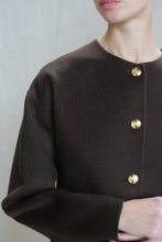 Load image into Gallery viewer, A person wearing the Cocoon Jacket in Watermark Brown.