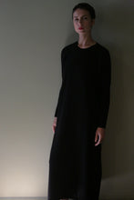 Load image into Gallery viewer, A person wearing a long-sleeved, black midi-length 100% cashmere Cashmere Sweater Dress | Black.