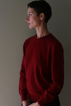 Load image into Gallery viewer, A person seen in profile wearing a burgundy High V-Neck Cashmere Sweater.
