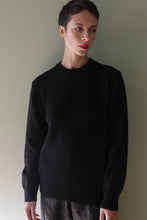 Load image into Gallery viewer, A person with short hair wearing a black Unisex Heavyweight Cashmere Crewneck.