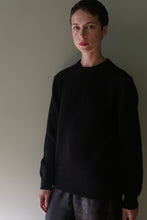 Load image into Gallery viewer, A person with short hair wears a black Unisex Heavyweight Cashmere Crewneck.