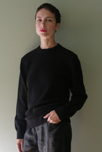 Load image into Gallery viewer, A person with short hair wearing a black Unisex Heavyweight Cashmere Crewneck.