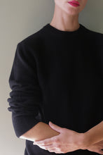 Load image into Gallery viewer, Unisex Heavyweight Cashmere Crewneck in black, featuring ribbed cuffs and a ribbed neckline.
