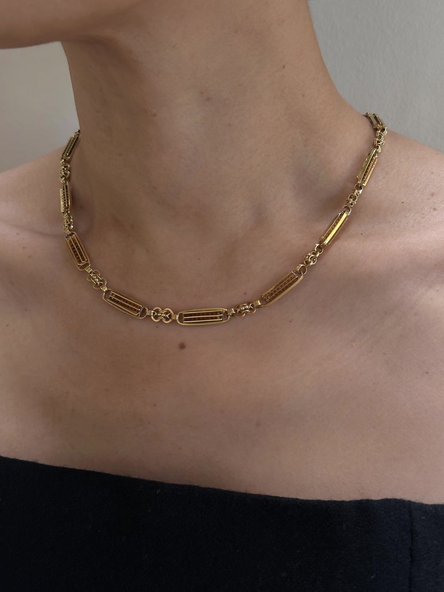 Close-up of a person's neck adorned with the 