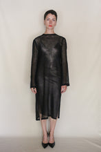 Load image into Gallery viewer, A person with short hair stands against a plain light background wearing the Crewneck Dress | Linen Leno Black and black pointed-toe heels, facing forward with a neutral expression.