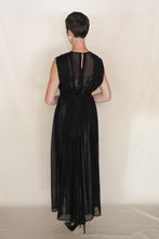 Load image into Gallery viewer, A person wearing the Shoulder Pleat Dress | Linen Leno Black—an ankle-length, sleeveless dress with shoulder pleats—paired with black heels stands back to the camera against a plain light background. Handmade in San Francisco.