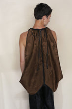 Load image into Gallery viewer, A person with short dark hair, seen from behind, wears the Butterfly | Xiang Yun Silk Lingering Fragrance top with a black center seam and neck drawstring, paired with dark pants against a plain light background.