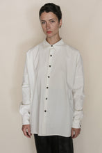 Load image into Gallery viewer, A person with short dark hair wears the Men's Shirt | Cotton Omizarashi Undyed, paired with dark pants, standing against a plain beige background with a neutral expression.
