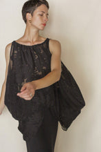 Load image into Gallery viewer, Wearing the sheer Lan Jaenicke Butterfly | Silk Uragiri Black top, a person poses gracefully against a light background with eyes closed and one arm extended outward.