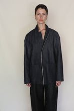 Load image into Gallery viewer, A person with short hair stands against a plain background, wearing the Painter's Jacket | Japanese Selvedge Denim and matching pants, looking straight at the camera with a neutral expression.